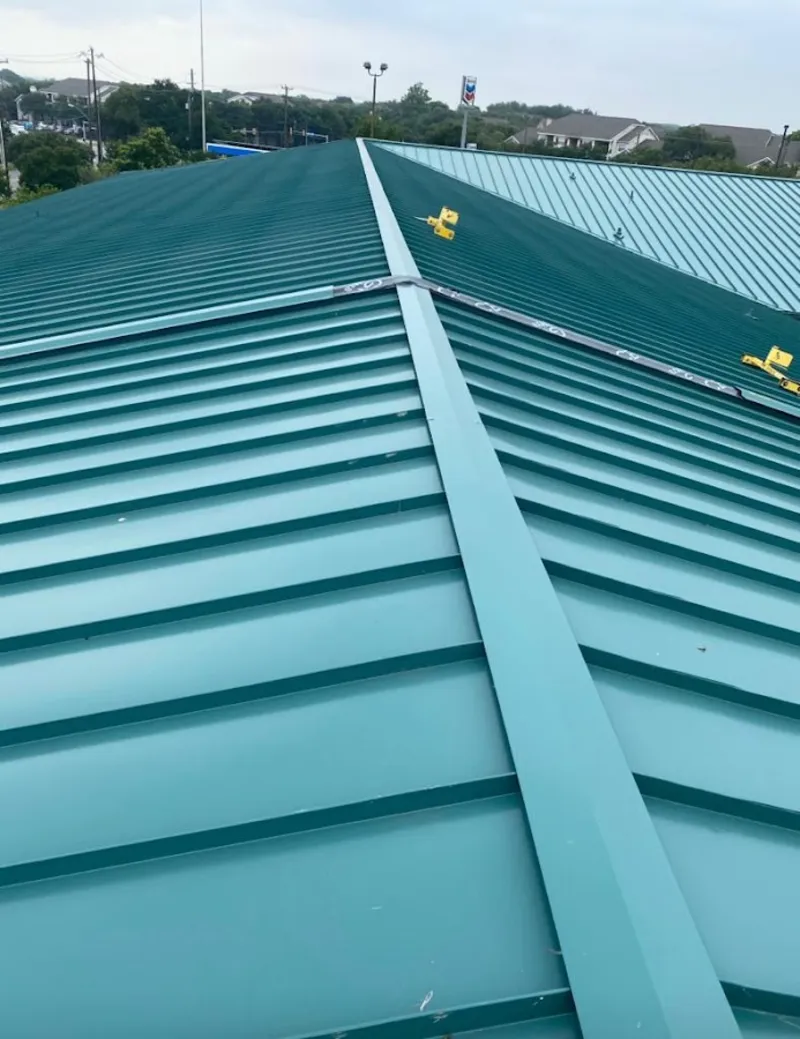 Green commercial metal roof ridge and valley for Metal Roof Repair in Stoughton